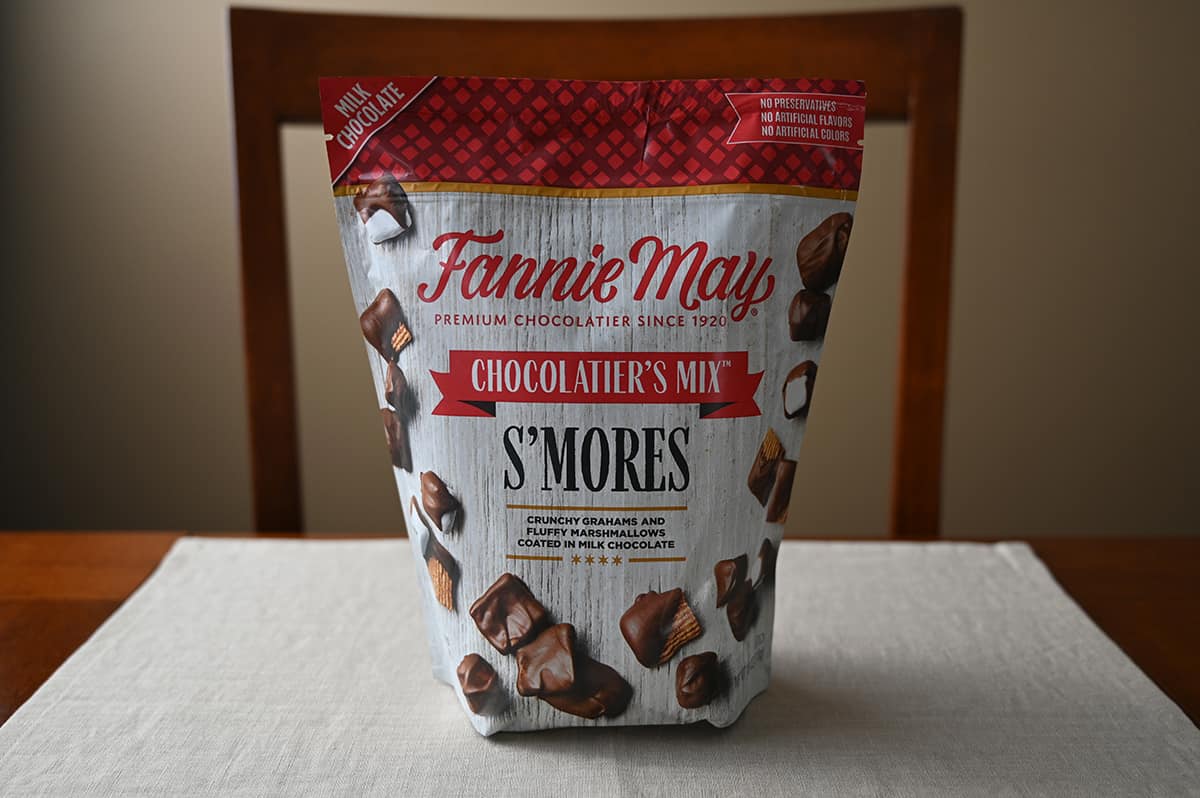 Image of the Costco Fannie May S'mores Snack Mix bag sitting on a table unopened.