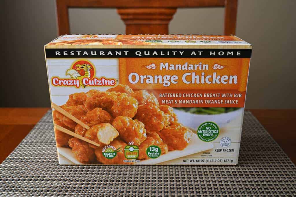 Image of the Costco Crazy Cuisine Mandarin Orange Chicken sitting on a table unopened.