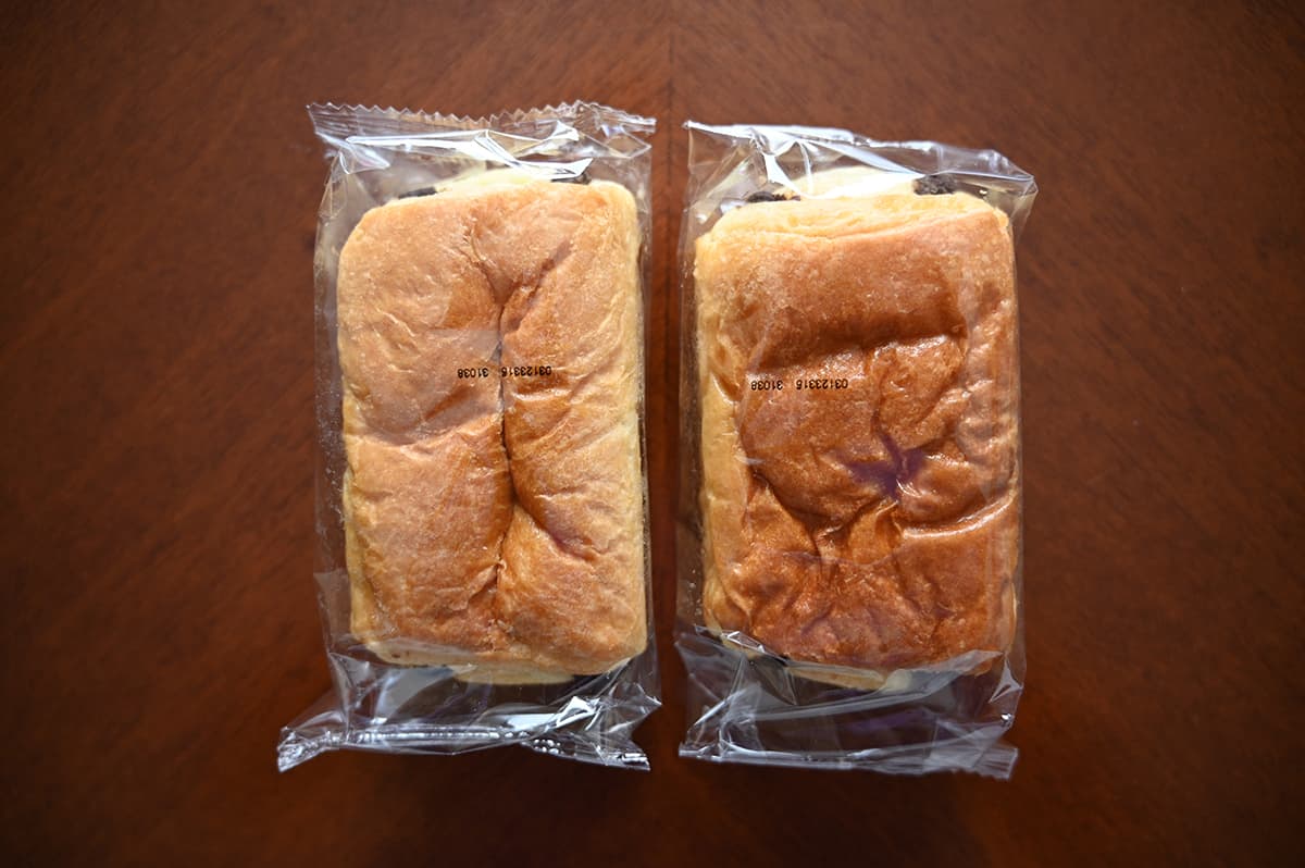 Top down image of two individually packaged Chocolatines sitting on a table.