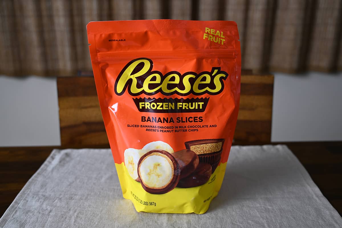 Costco Reese's Frozen Fruit Banana Slices bag sitting on a table unopened.