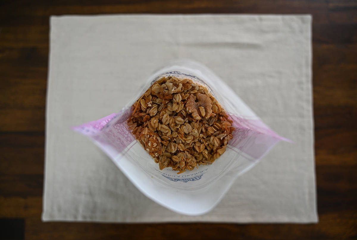Top down image of the Costco Anahola Granola bag opened so you can see the granola inside. Sitting on a table.