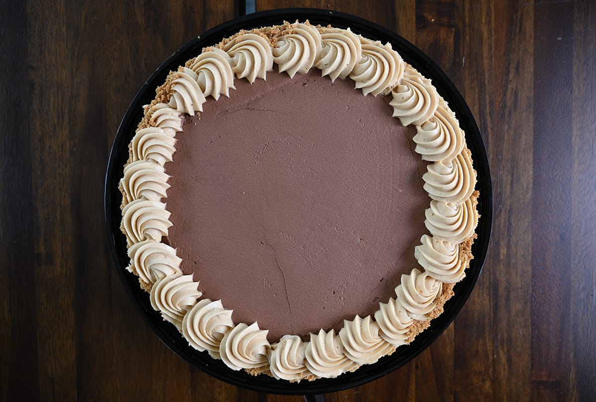 Top down image of the whole peanut butter pie opened with the lid off.