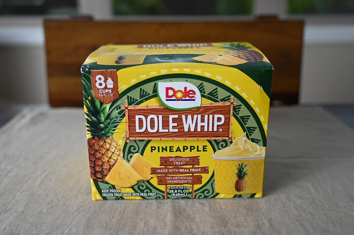 Side view image of the Costco Dole Whip box sitting on a table unopened. 