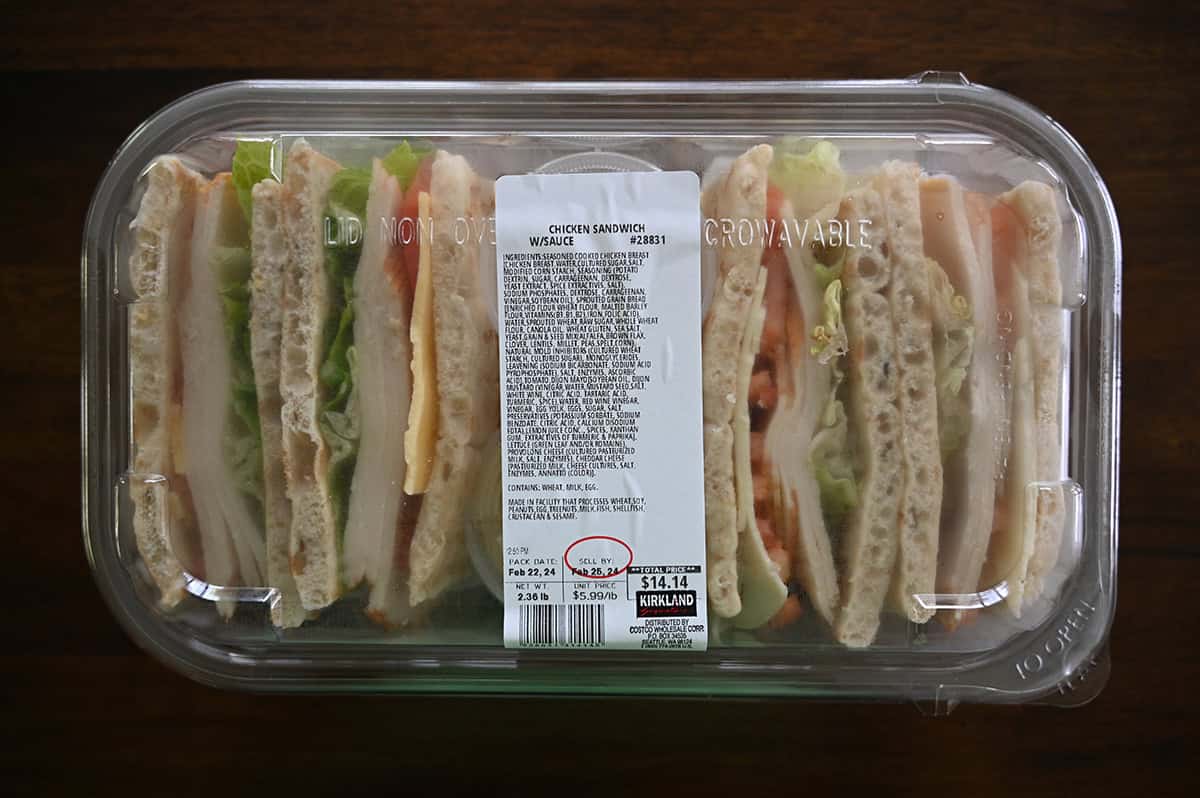 Image of the Costco Kirkland Signature Chicken Sandwich with Sauce packaging sitting on a table unopened.