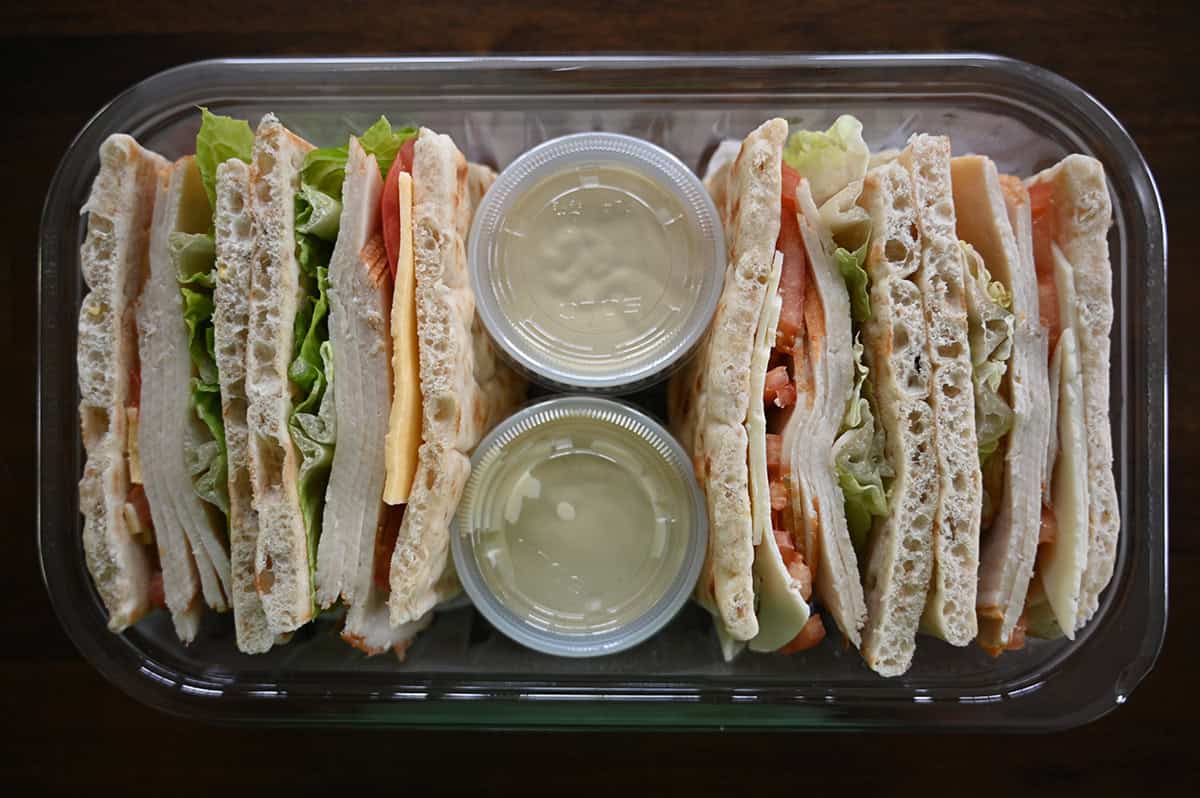 Top down image of an opened Costco Kirkland Signature Chicken Sandwich with Sauce package sitting on a table opened.