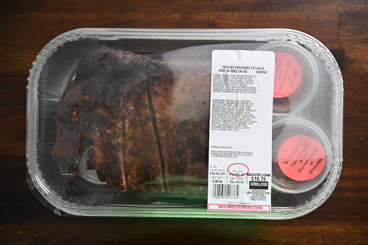 Top down image of the Costco Kirkland Signature Chilled Seasoned St. Louis Ribs container sitting on a table unopened.