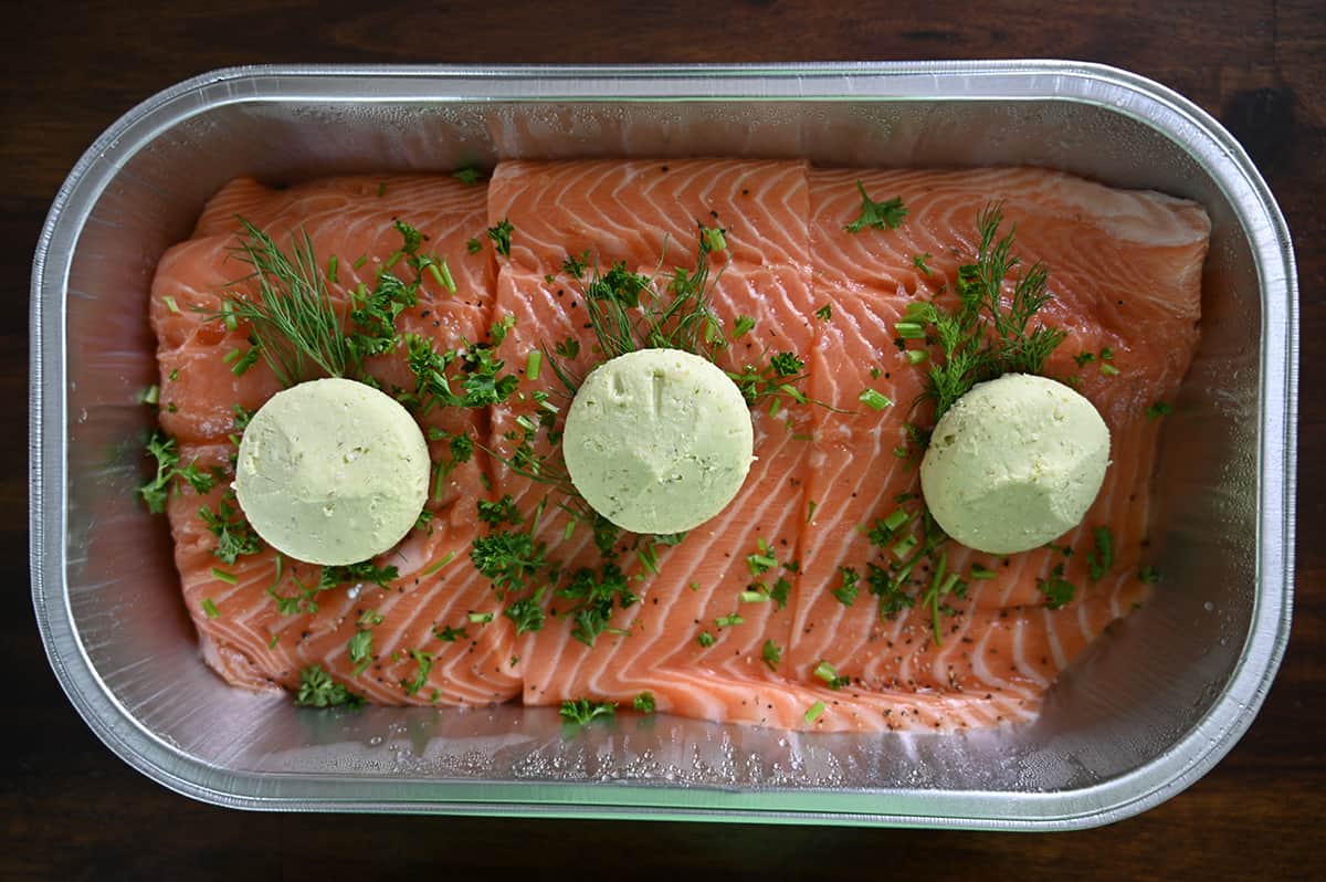 top down image of the salmon tray open with the lid off so you see three large pieces of salmon.