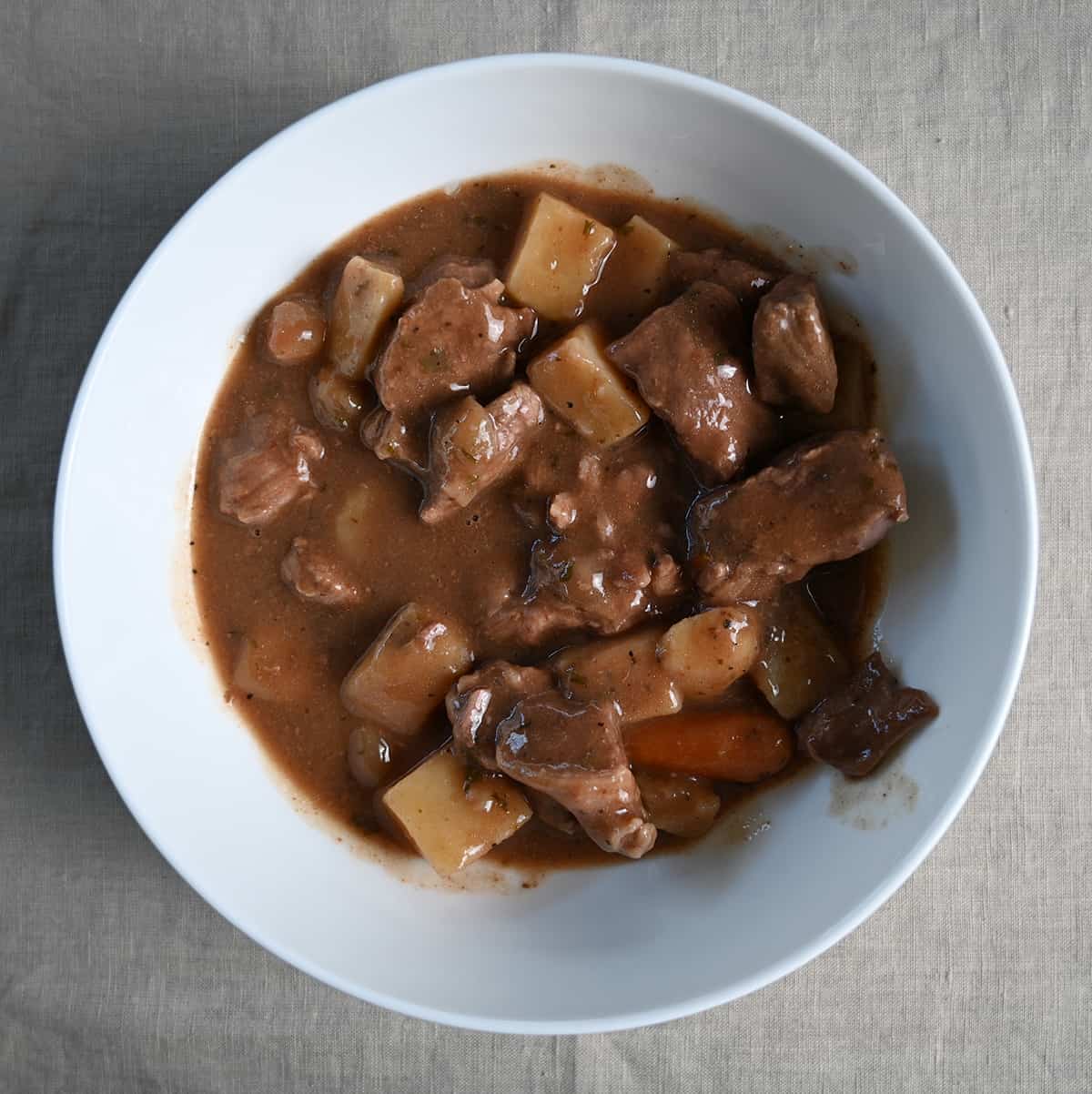 Closeup top down image of a bowl of stew. 