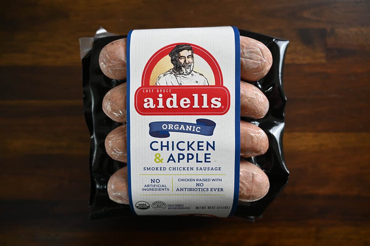 Costco Aidells Organic Chicken & Apple Smoked Chicken Sausage package sitting on a table unopened.