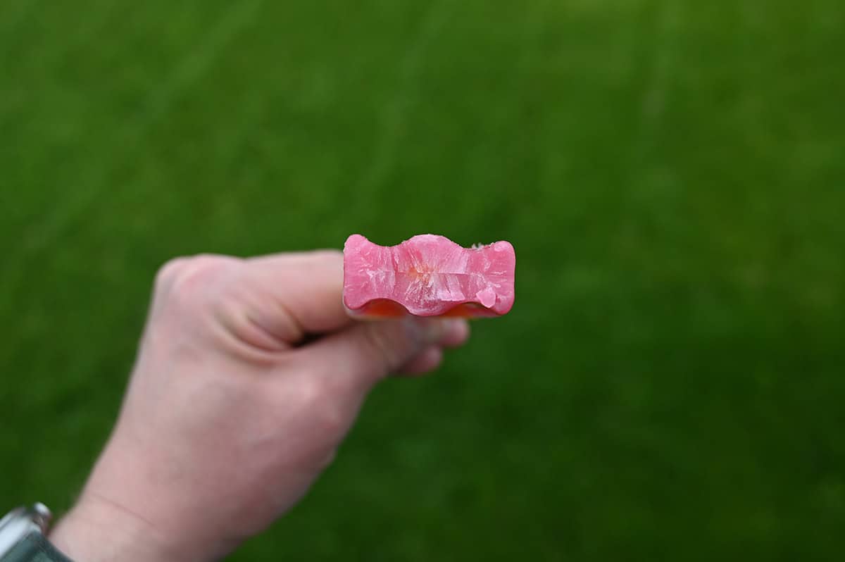Image of a hand holding a Jonny pop with a few bites taken out of it showing what it looks like in the middle. 