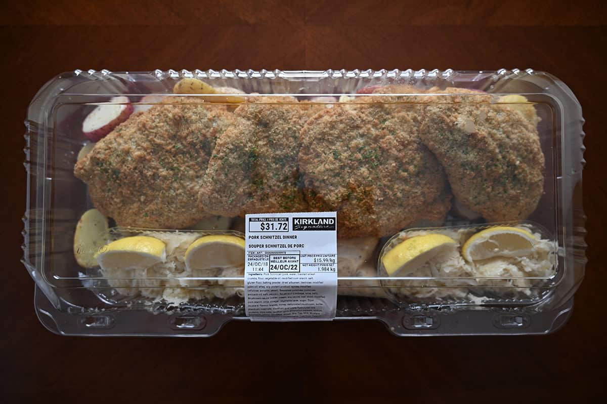 Image of the Costco Kirkland Signature Pork Schnitzel Dinner sitting on a table unopened.