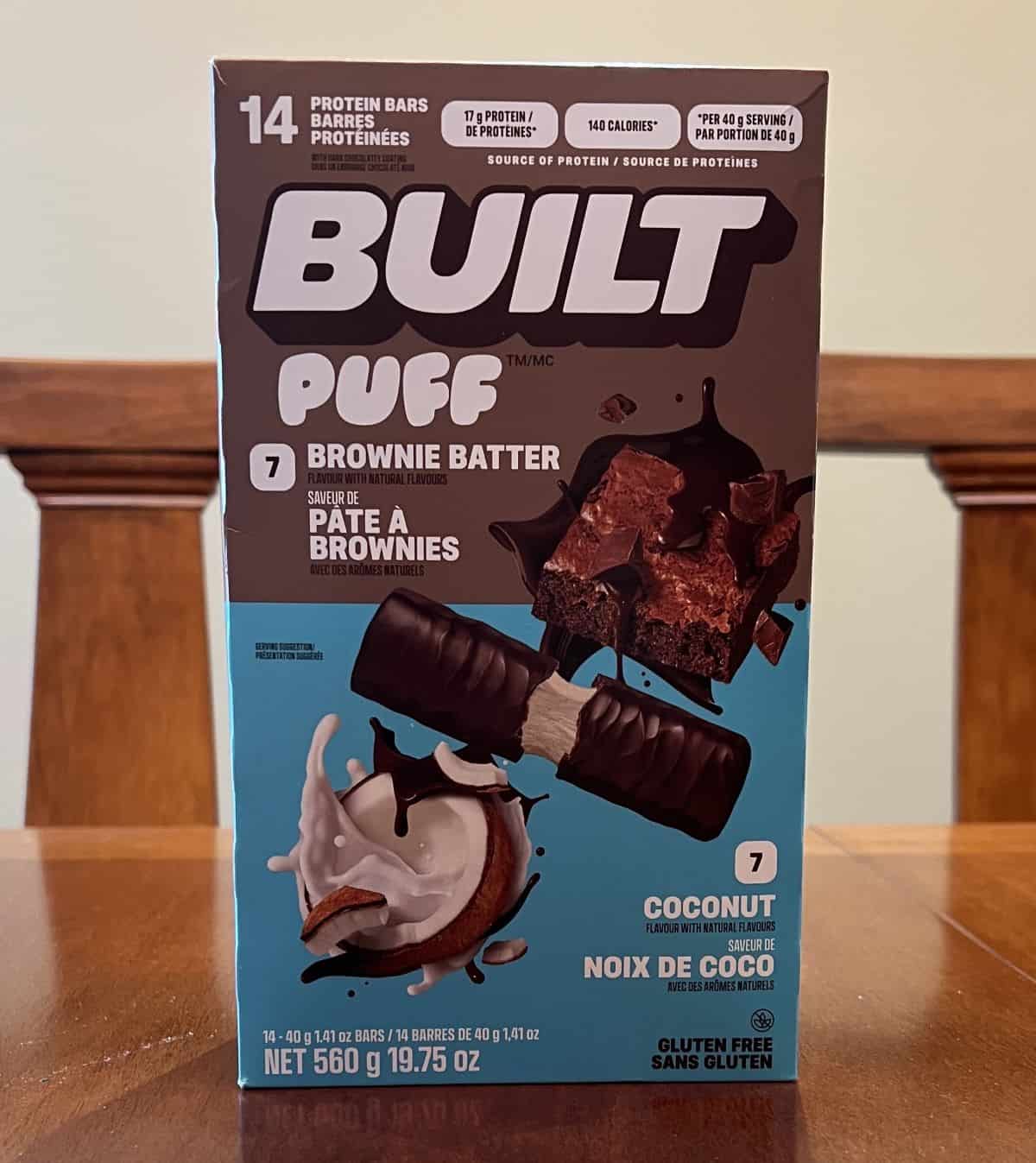 Image of the Costco Built Puff Protein Bars box sitting on a table unopened.