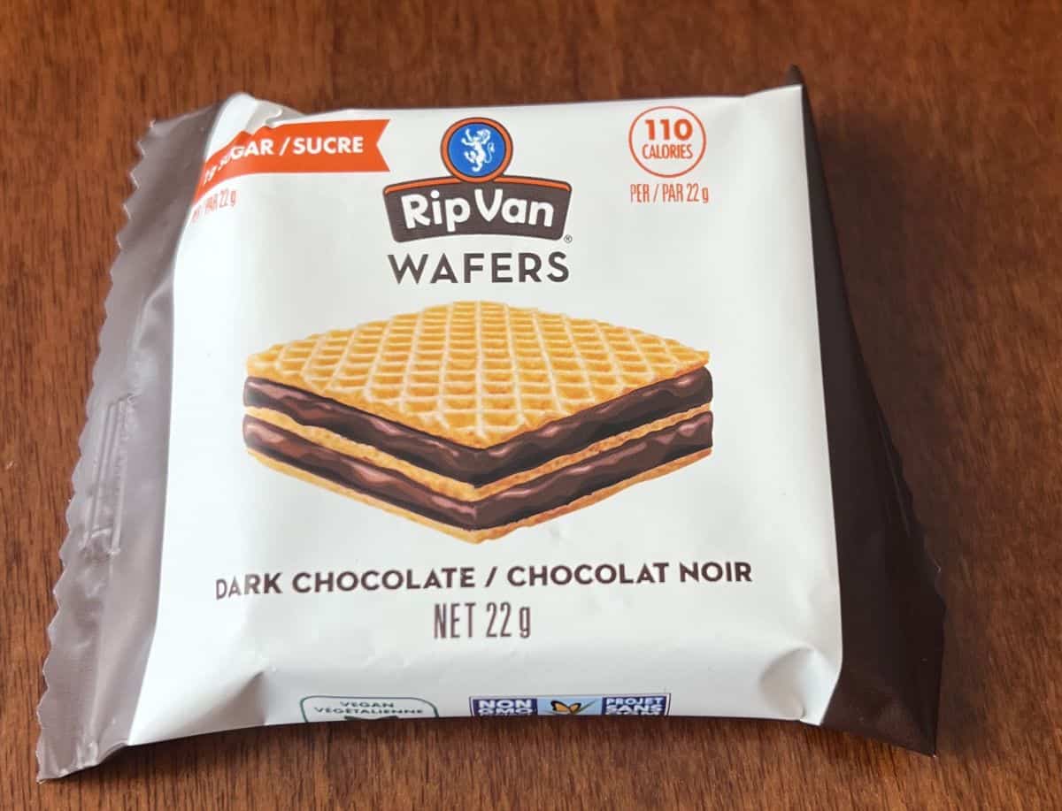 Image of one individually wrapped wafer cookie sitting on a table unopened. 