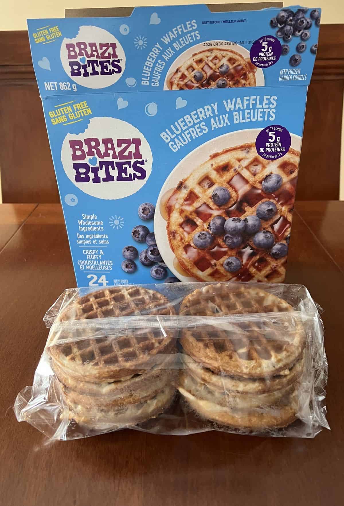Image of a package of Brazi Bites waffles sitting in front of the box for waffles on a table, unopened.