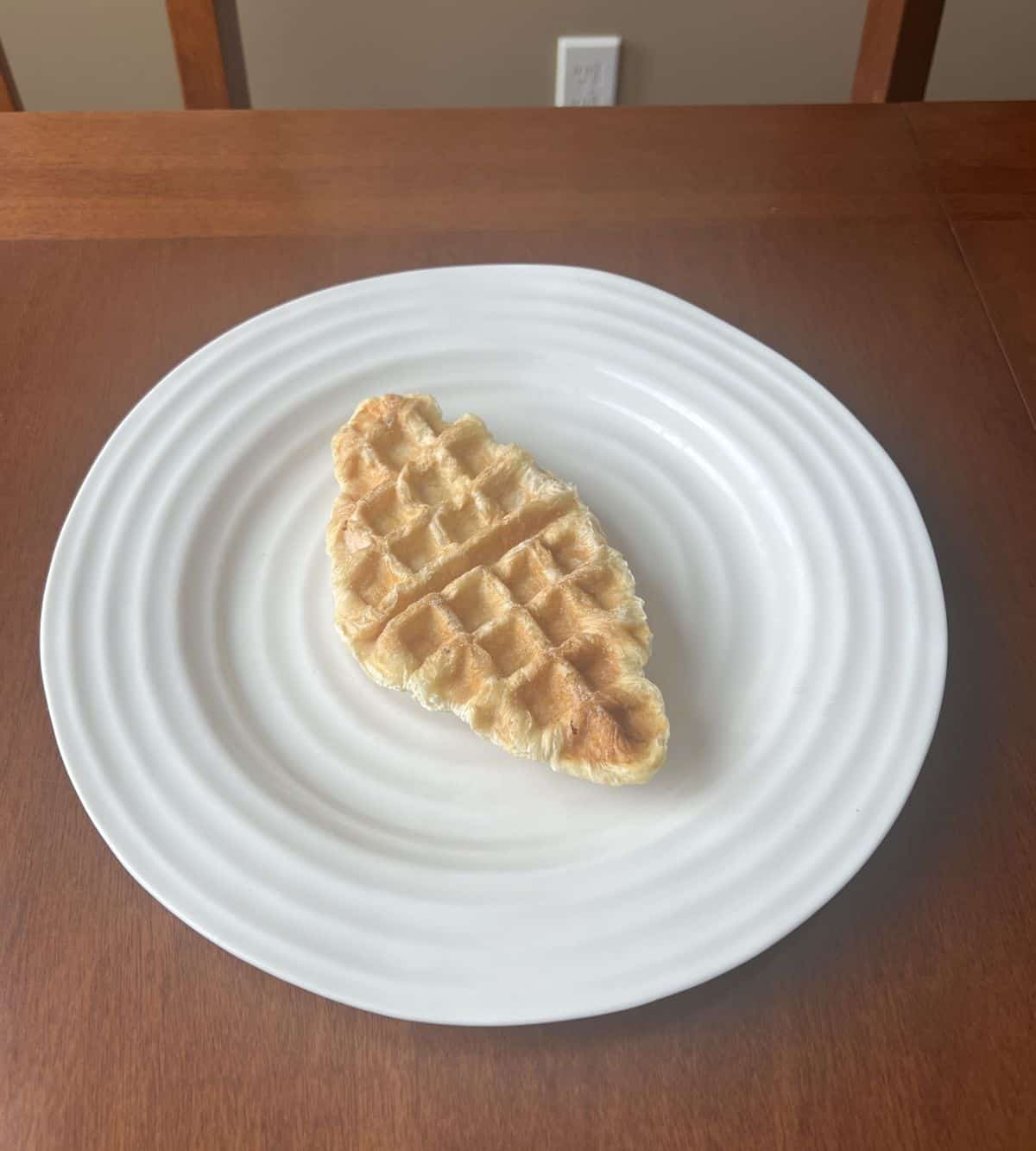 Image of one frozen Croffle served on a white plate.