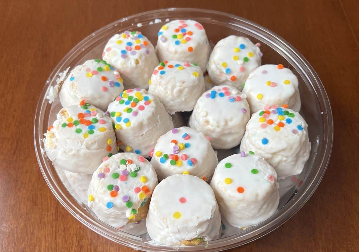 Top down image of the Costco Upper Crust Bakery Birthday Cake Bites container opened so you can see the cake bites.
