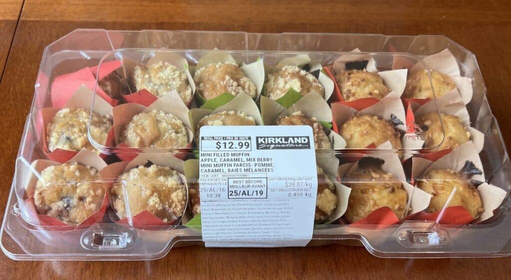 Image of the Costco Kirkland Signature Mini Filled Muffins package sitting on a table unopened.