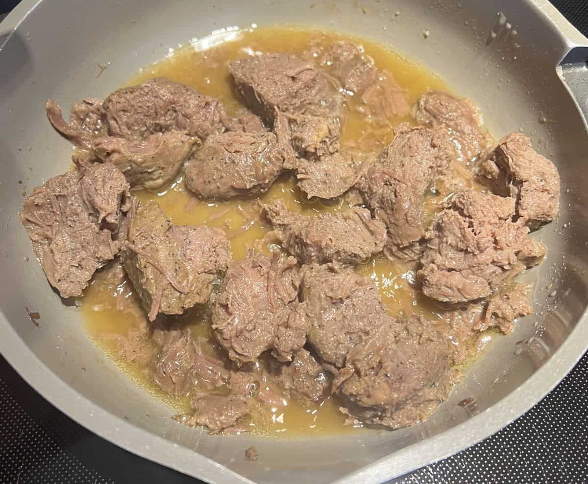 Image of the steak bites being heated in a pan.