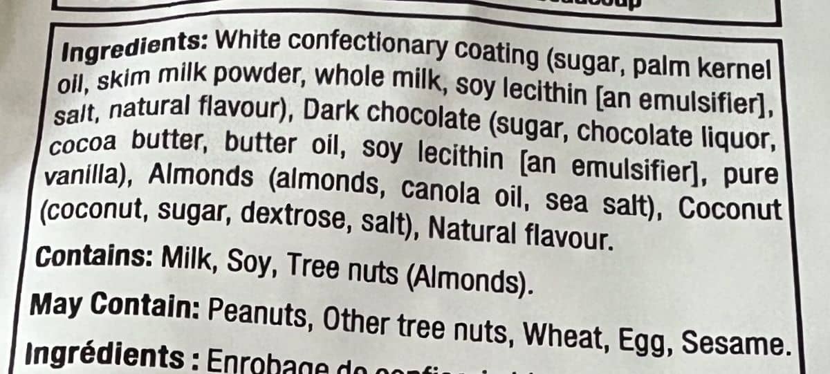 Image of the ingredients for the Costco Edward Marc Chocolatier Coconut Almonds. 