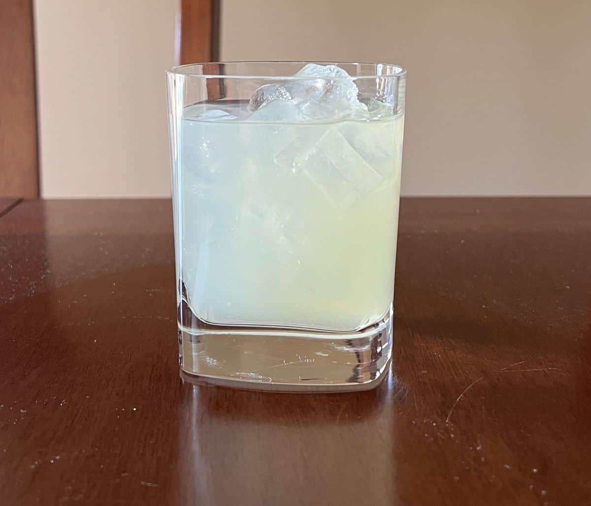 Image of a margarita made in a glass with ice in it.