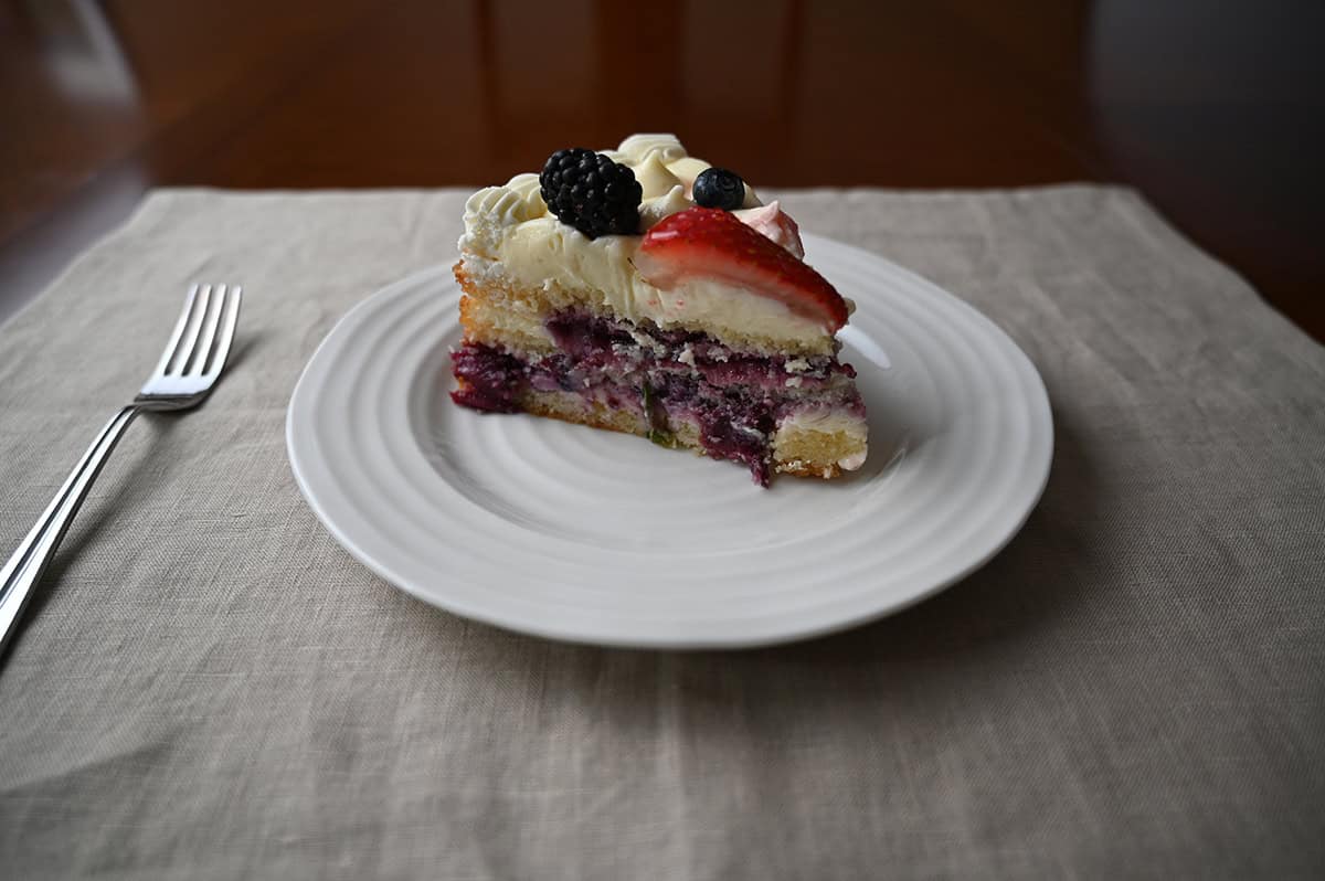 Image of one slice of Chantilly cake served on a white plate. 