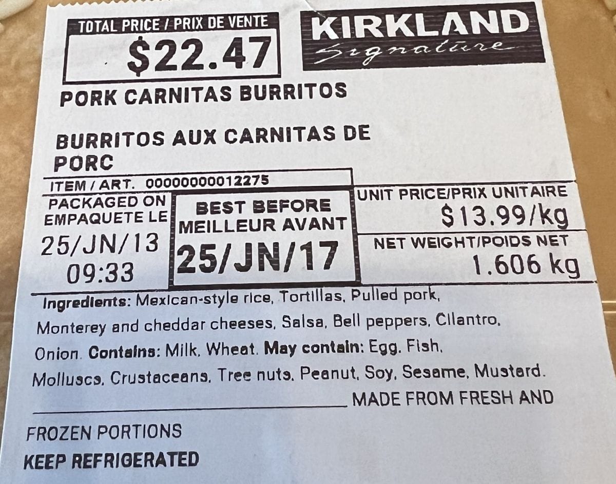 Closeup image of the label on the Costco Kirkland Signature Pork Carnitas Burritos showing expiry date, ingredients and cost.