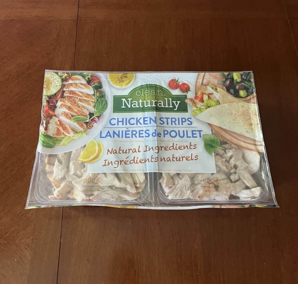 Image of the Costco Clean Naturally Chicken Strips package sitting on a table unopened. 