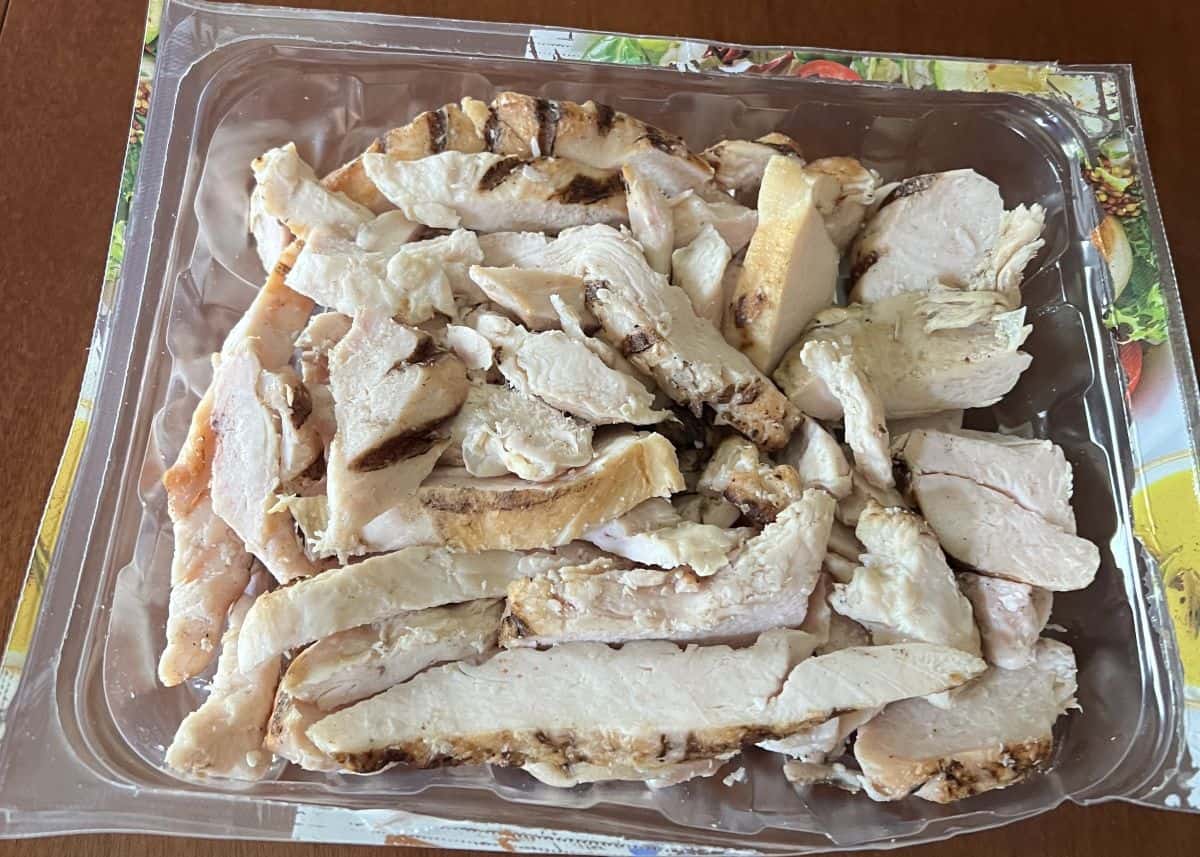 Image of a package of chicken strips open so you can see the chicken strips in it.