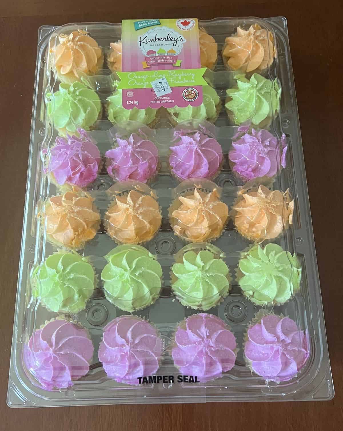 Image of the Costco Kimberly's Bakeshoppe Cupcakes package sitting on a table unopened. 