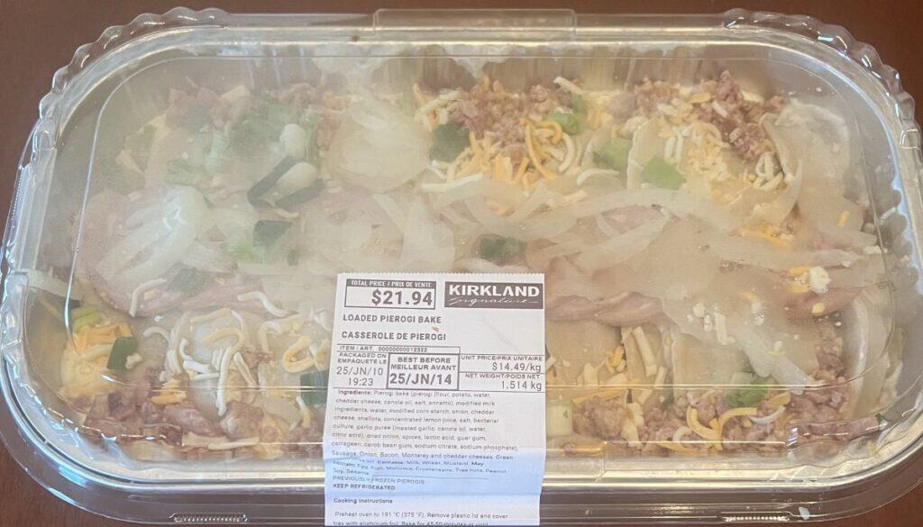 Image of the Costco Kirkland Signature Loaded Pierogi Bake container sitting on a table unopened. 