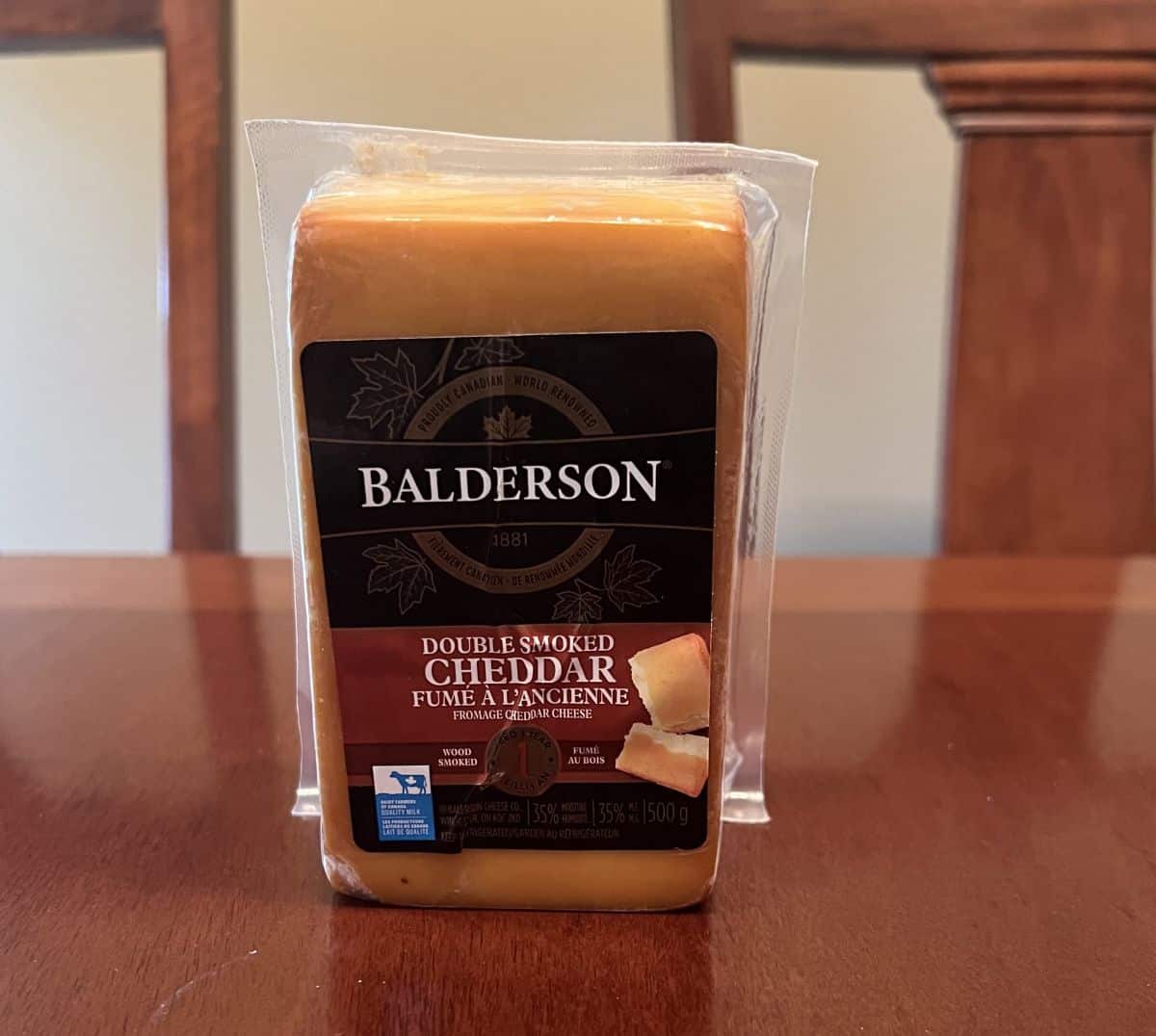 Image of the Costco Balderson Double Smoked Cheddar sitting on a table unopened.