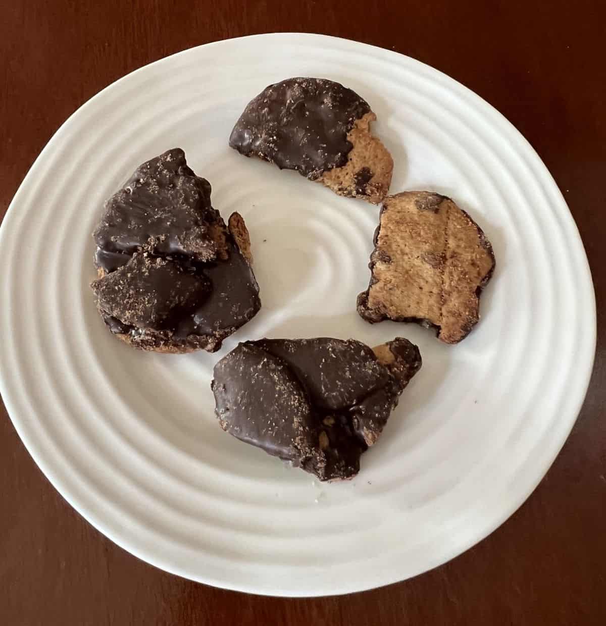 Image of four pieces of cookie bark served on a white plate. 