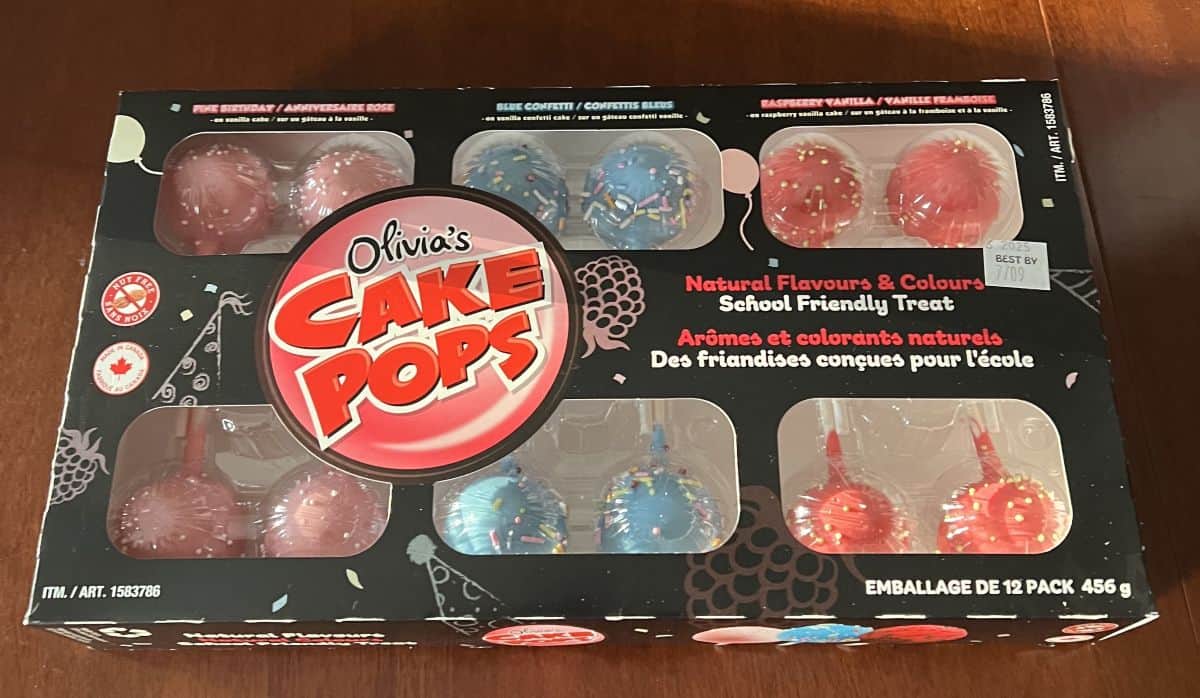 Image of the Costco Olivia's Cake Pops box sitting on a table unopened.