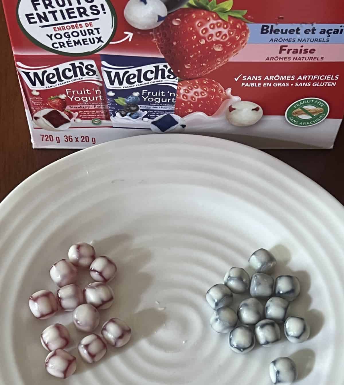 Image of the strawberry fruit snacks and blueberry-acai fruit snacks served on a white plate.