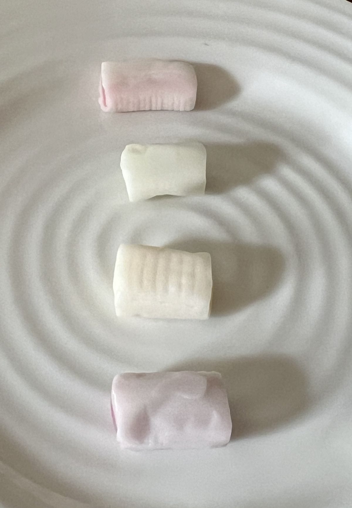 Image of four Hi Chew candies unwrapped and served on a white plate.