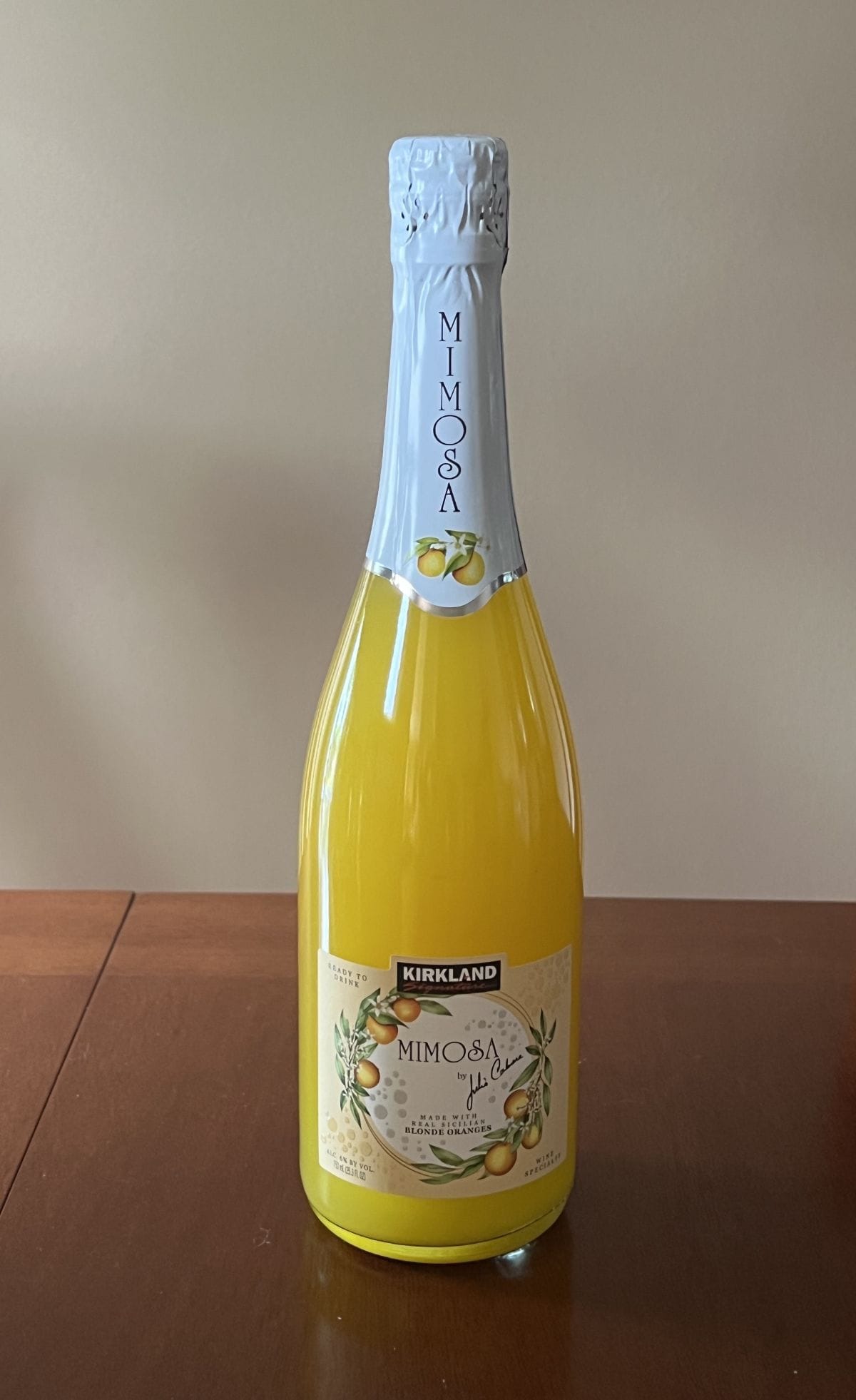Image of the Costco Kirkland Signature Mimosa bottle sitting on a table. 