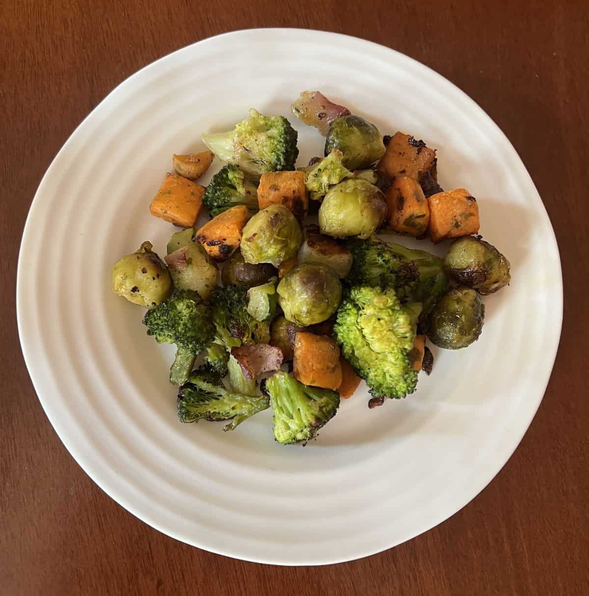 Top down image of a bowl of roasted vegetables. 