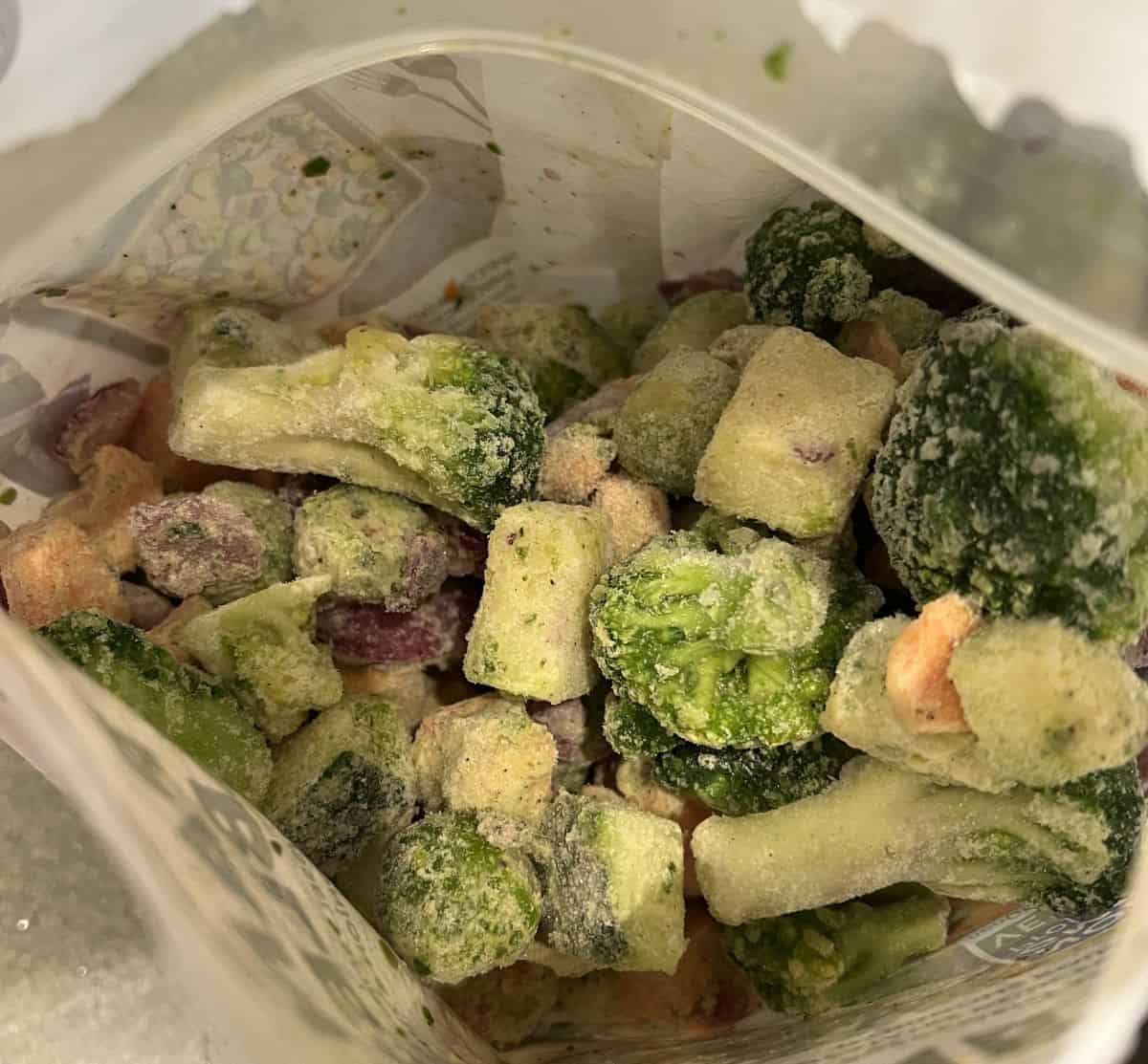 Image of an open bag of Costco Tattooed Chef Sheet Pan Vegetables so you can see the frozen vegetables inside.