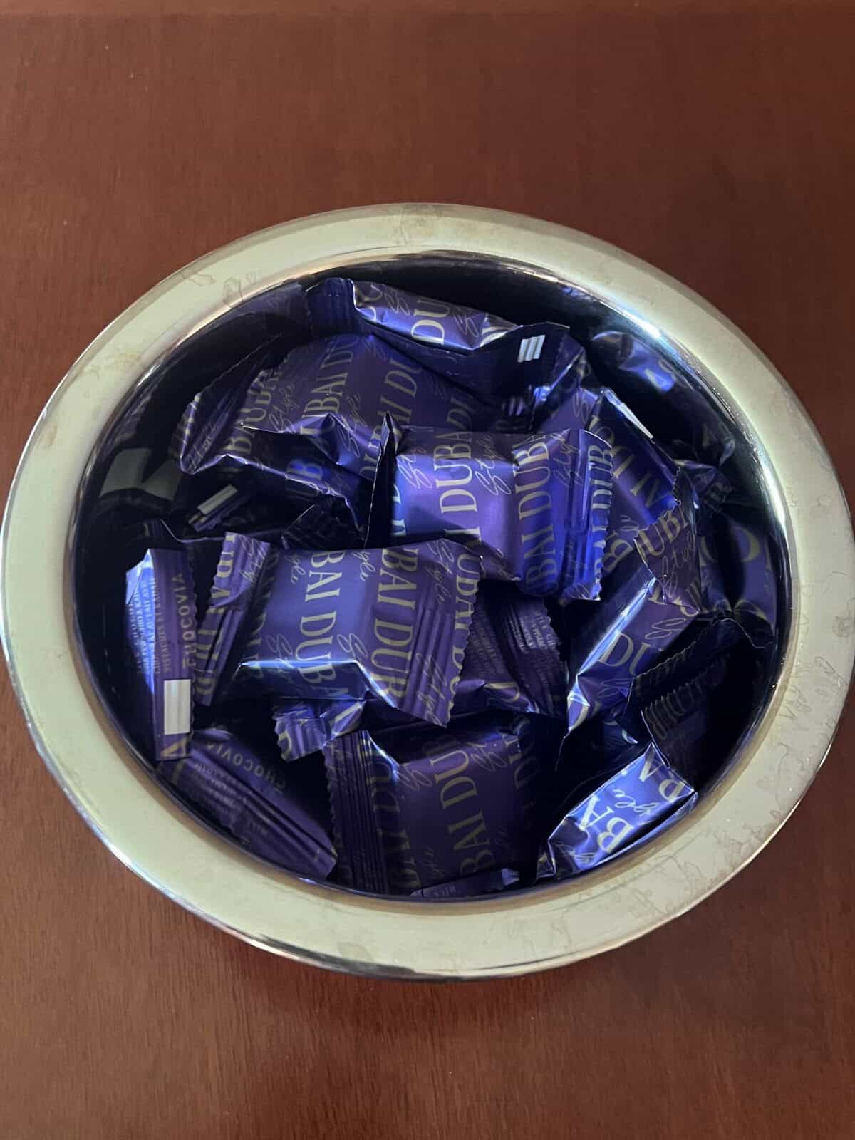 Image of the Dubai chocolates wrapped and served in a metal bowl. 