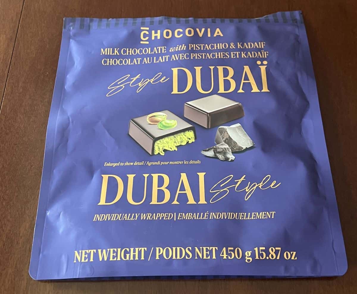 Closeup top down image of the bag of the bag of chocolates showing the weight, of the bag and product name. 