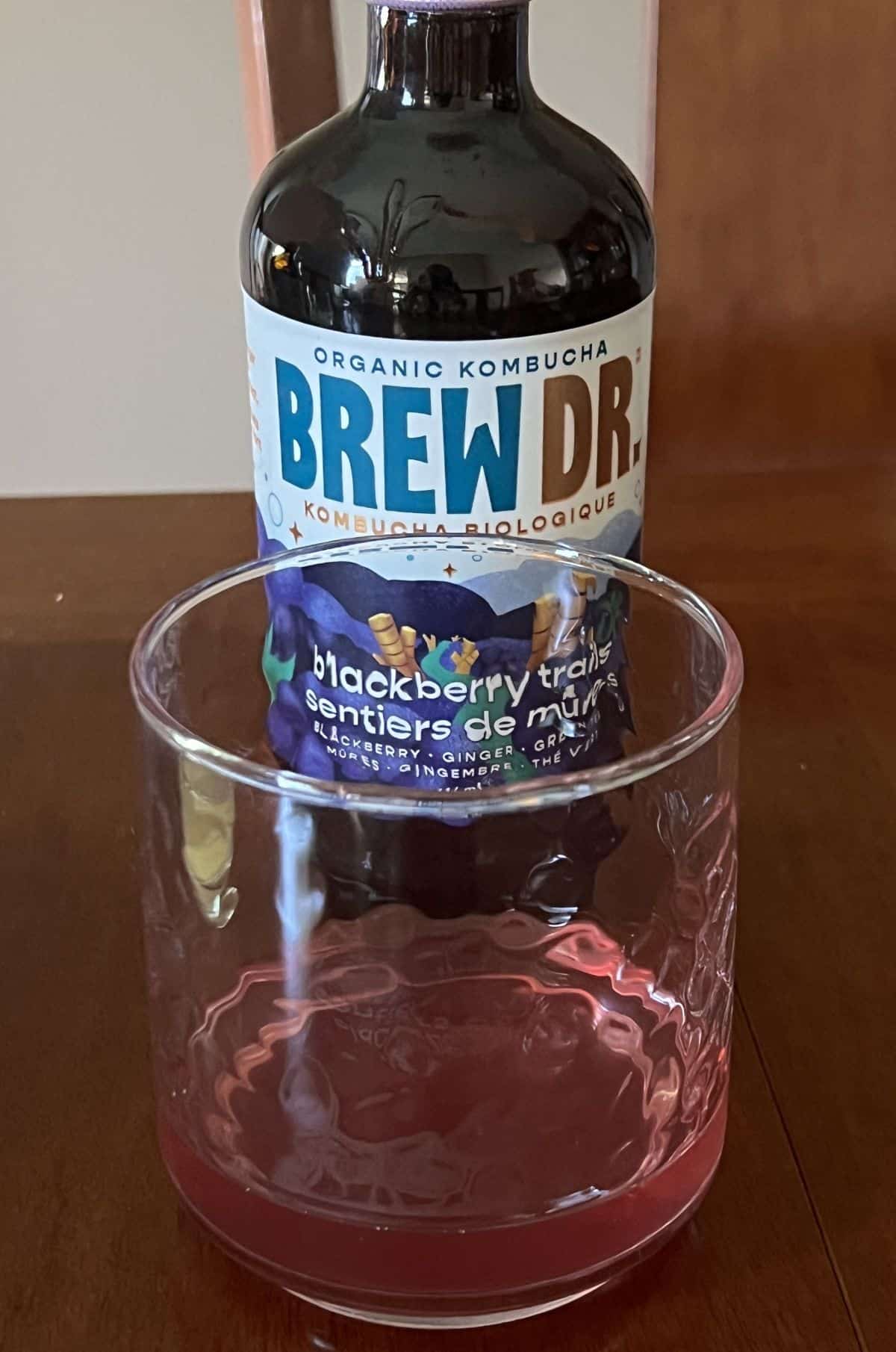 Image of a glass of the blackberry trails kombucha, 