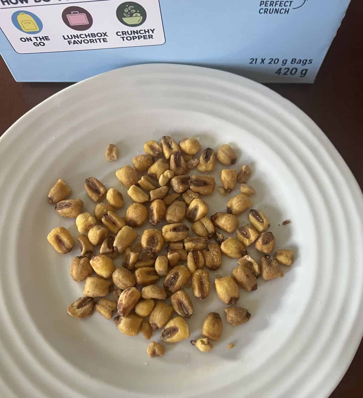 Top down image of the Love Corn served on a white plate so you can see all the individual corn kernels. 