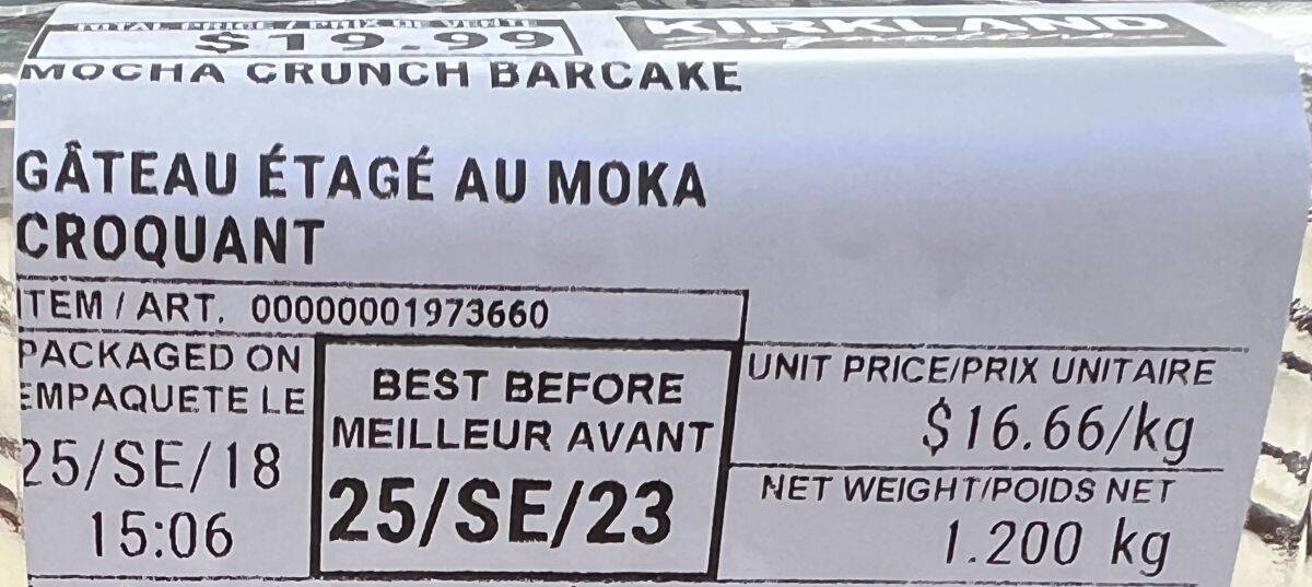 Image of the front label on the cake showing cost and expiry date.