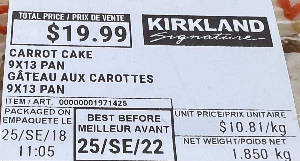 Closeup image of the front label on the carrot cake showing cost and best before date.