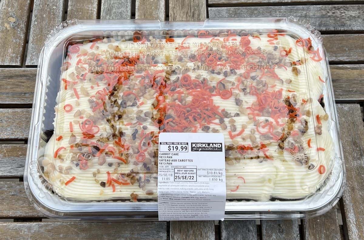 Image of the Costco Kirkland Signature Carrot Cake sitting on a table unopened.