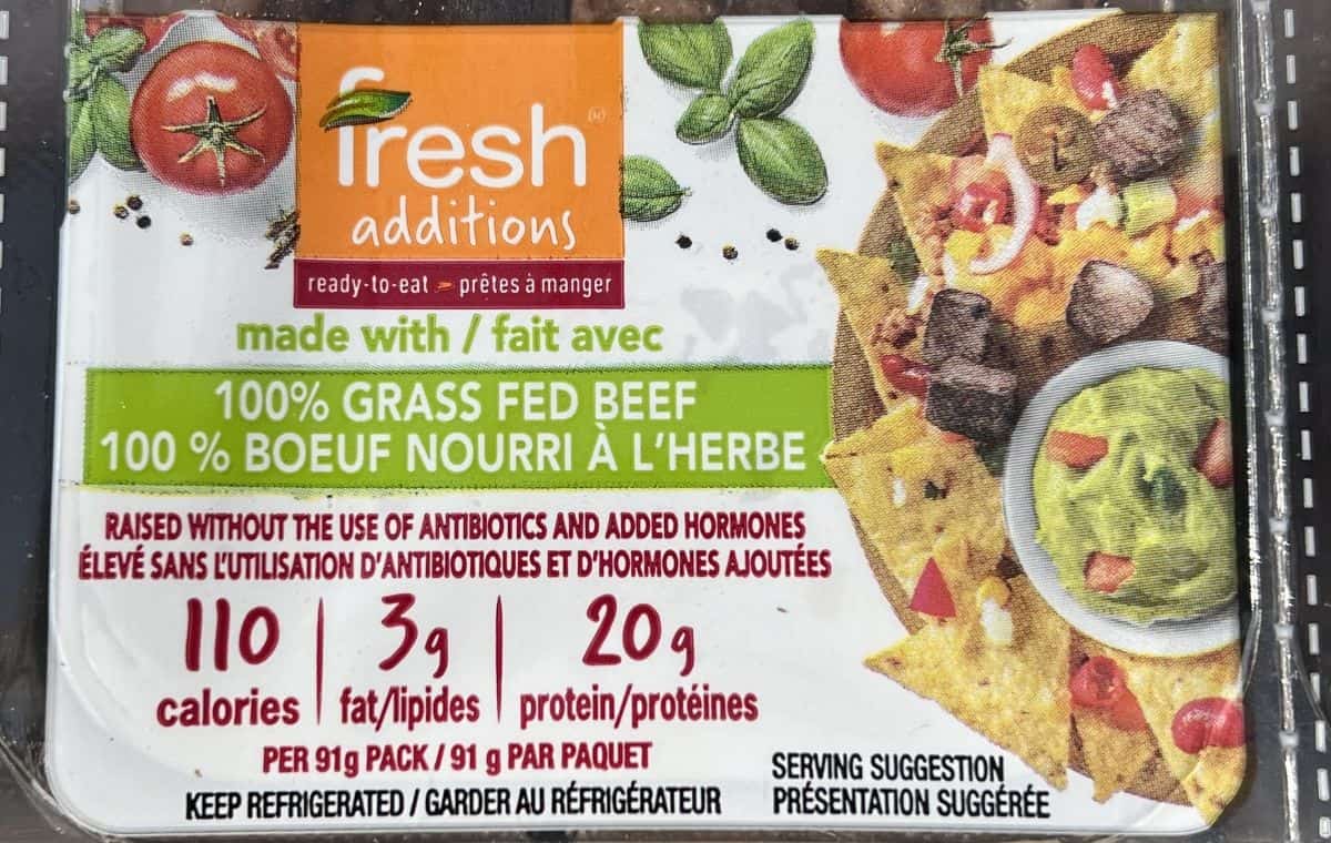 Closeup image of one pack of steak bites showing that the beef is grass fed.