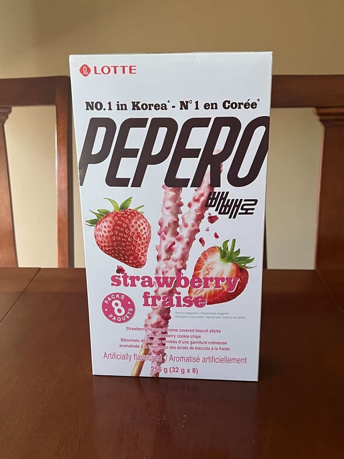 Image of the Costco Lotte Pepero Strawberry box sitting on a table unopened.