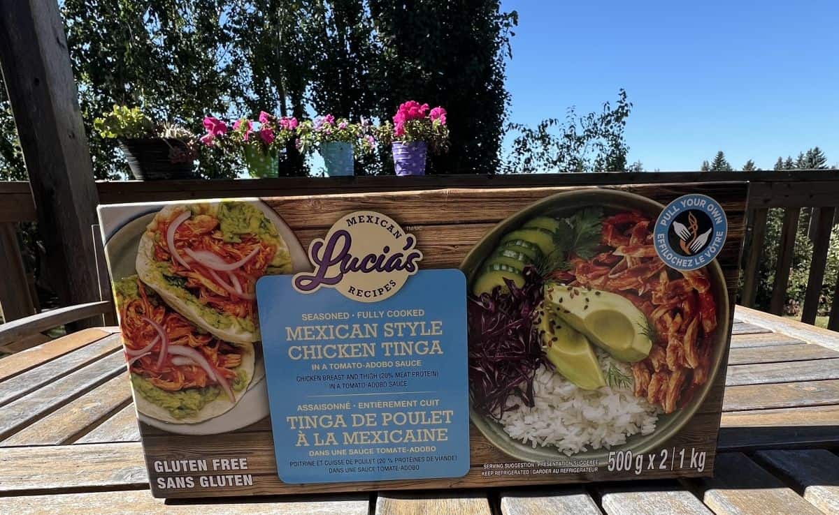 Image of the Lucia's Mexican Style Chicken Tinga box sitting on a table outside unopened.