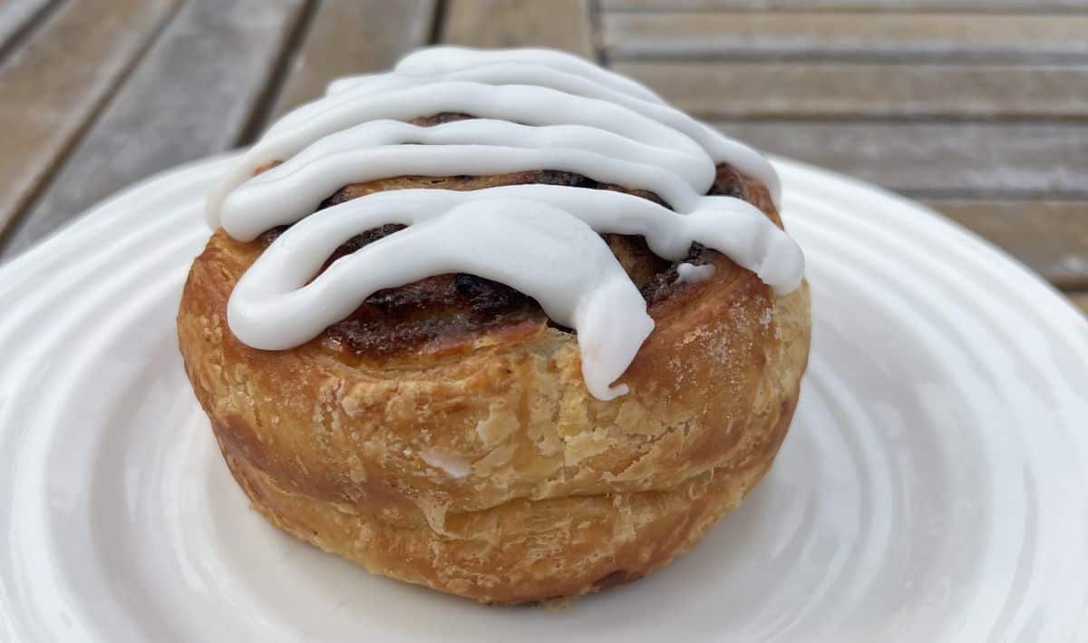 Closeup side view image of one swirl served on a white plate.