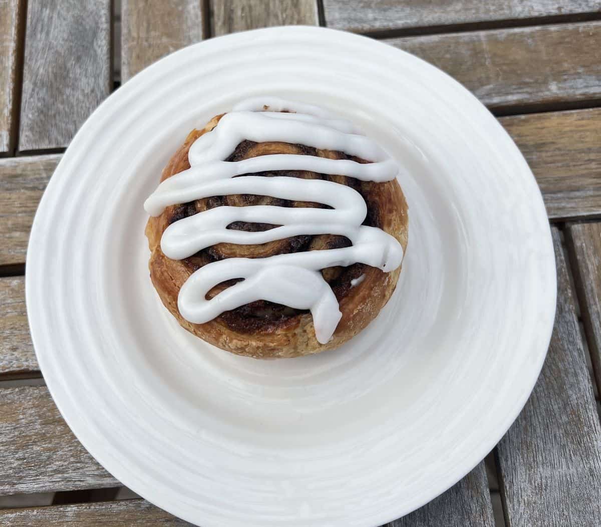 Top down image of one cookies & cream swirl served on a white plate.